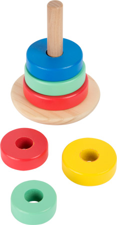 Baby playing with wooden stacking ring tower